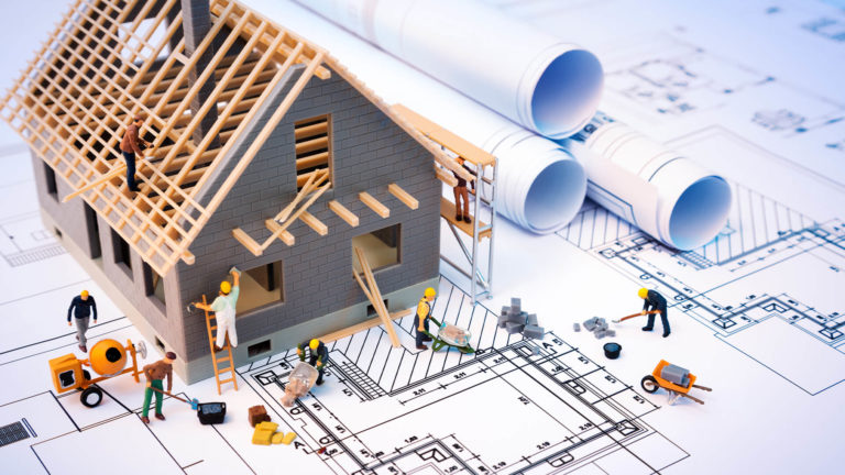 a group of people working on a house
