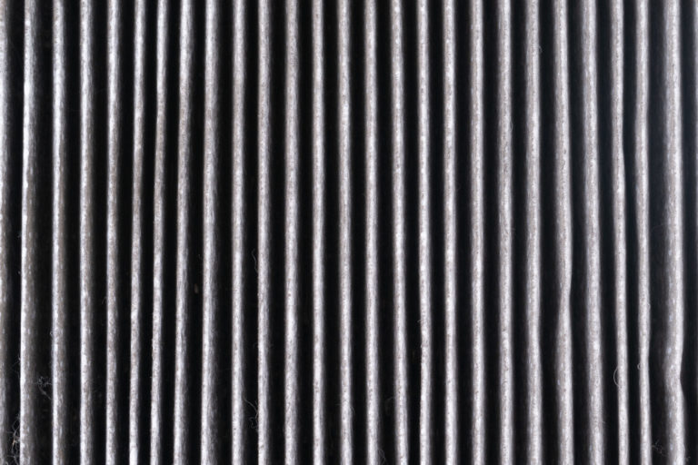 a black and white photo of a black and white striped wall