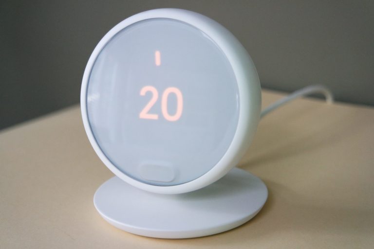a white round object with a red number on it