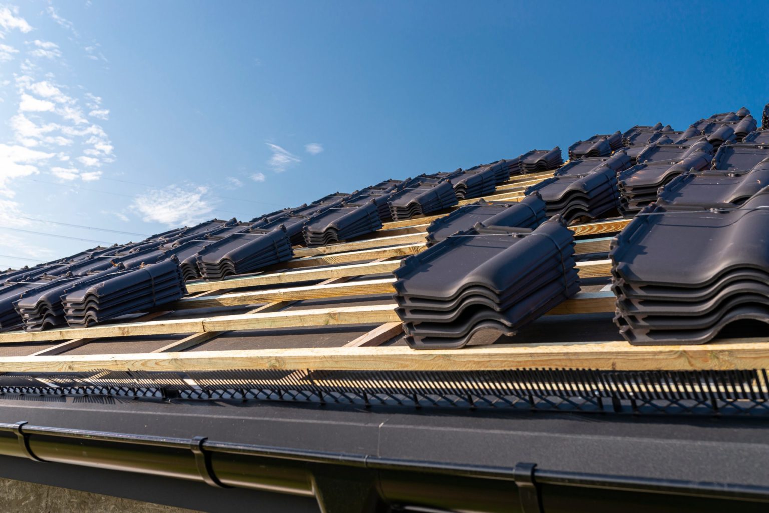 roof-ceramic-tile-arranged-in-packets-on-the-roof-2021-11-09-20-05-02-utc (1)