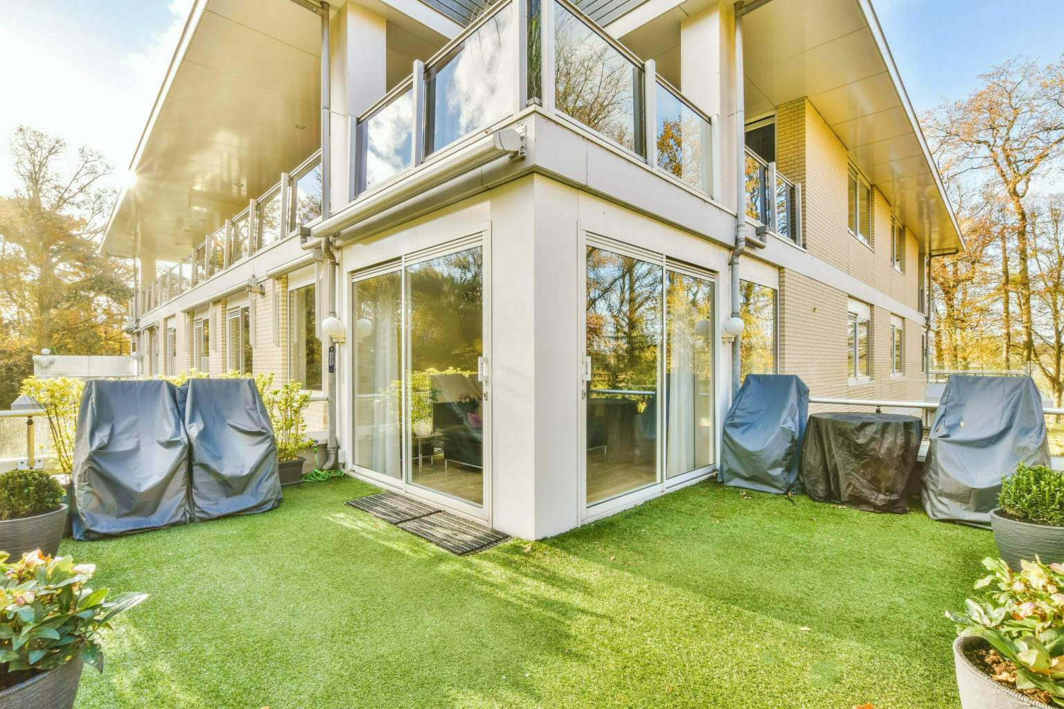 Comfortable balcony with artificial grass