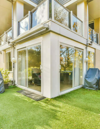 Comfortable balcony with artificial grass